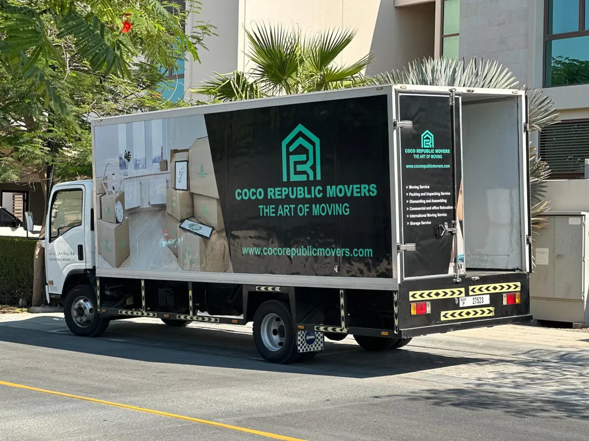 Movers and packers truck parked outside a villa in Dubai