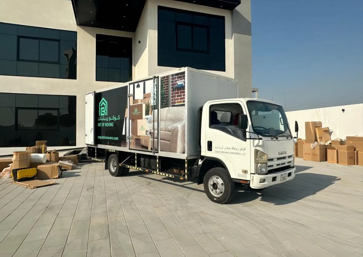 Moving truck and packed cartons outside a villa in Dubai